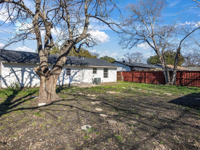 rear view of property featuring cooling unit