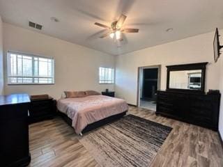 bedroom with ceiling fan and light hardwood / wood-style flooring