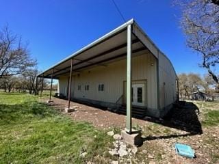 view of property exterior with a carport