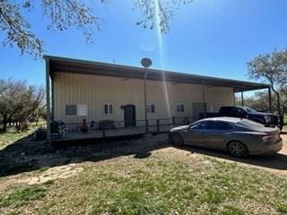 view of property exterior featuring a carport and a lawn