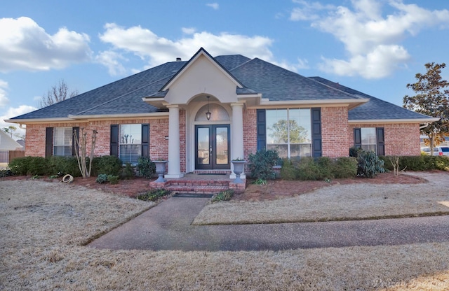 ranch-style house featuring french doors