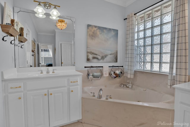 bathroom featuring crown molding, vanity, tile patterned flooring, and a bathtub