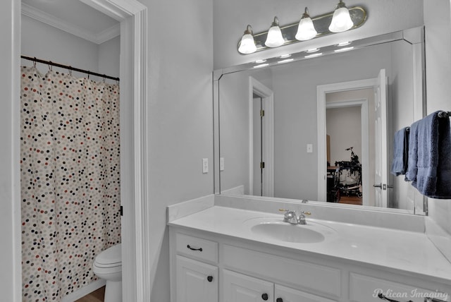 bathroom featuring vanity, crown molding, toilet, and a shower with shower curtain