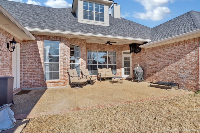 rear view of house featuring outdoor lounge area, a patio, and ceiling fan