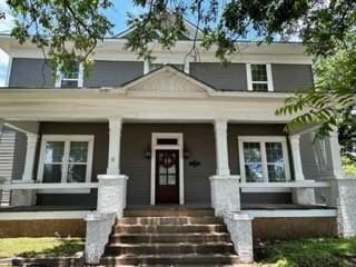 view of front of property featuring covered porch