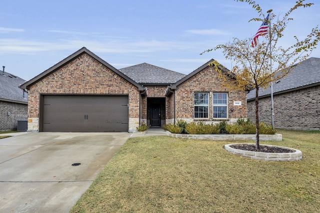 view of front of house with cooling unit, a front yard, and a garage