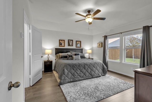 bedroom with ceiling fan and hardwood / wood-style flooring