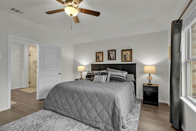 bedroom featuring connected bathroom, ceiling fan, and hardwood / wood-style flooring