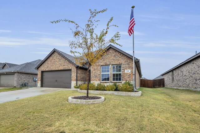 view of front of home featuring a garage and a front lawn