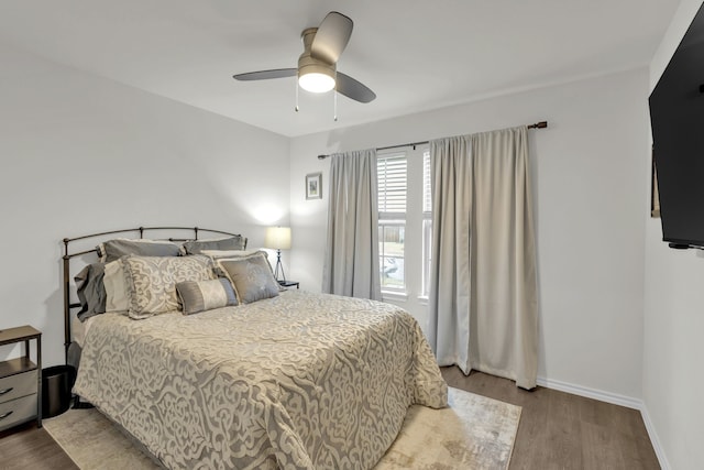 bedroom with ceiling fan and light hardwood / wood-style floors