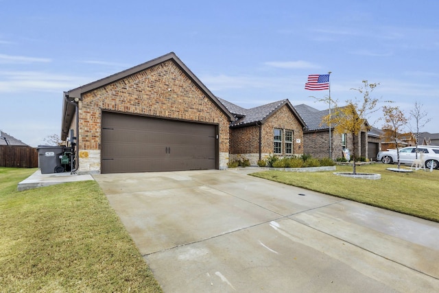 view of front of home featuring a garage and a front yard