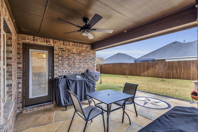 view of patio featuring area for grilling and ceiling fan