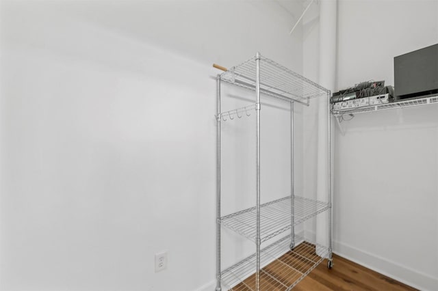 walk in closet featuring hardwood / wood-style floors