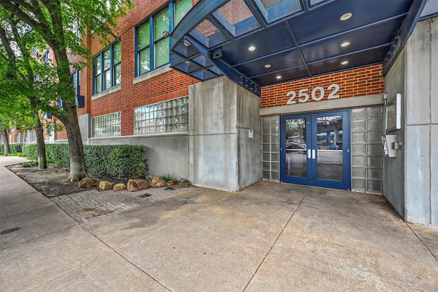 view of exterior entry featuring french doors