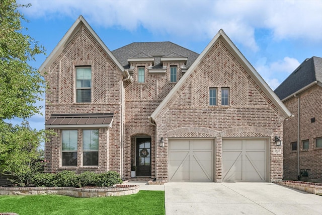 view of front facade featuring a garage and a front lawn