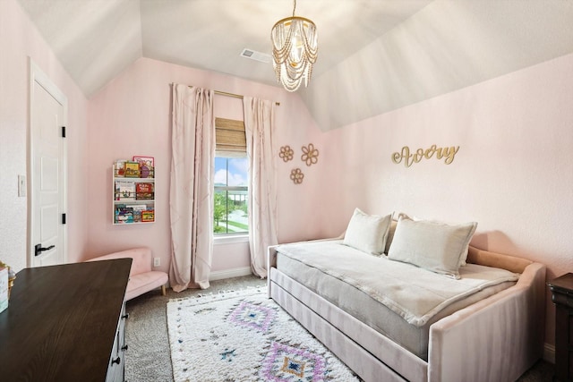 carpeted bedroom featuring a chandelier and vaulted ceiling