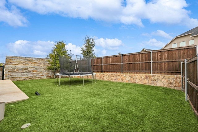 view of yard featuring a trampoline