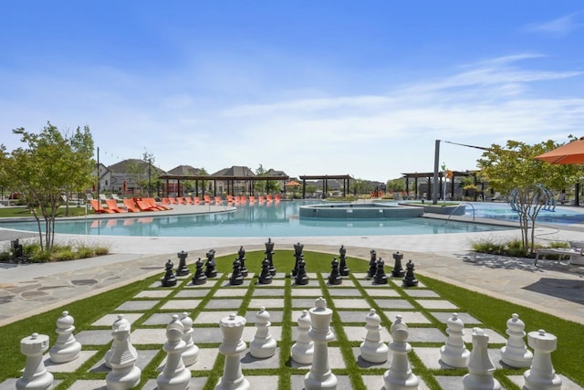 view of swimming pool with a patio area