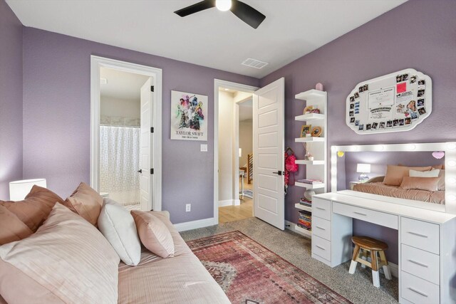 bathroom featuring curtained shower, toilet, and vanity