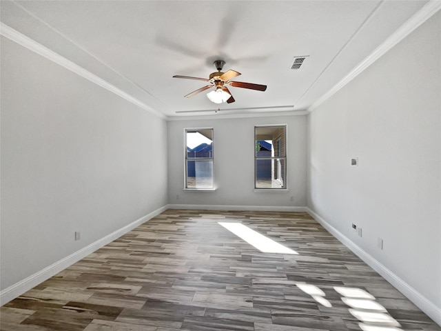 spare room with crown molding, ceiling fan, and dark hardwood / wood-style flooring