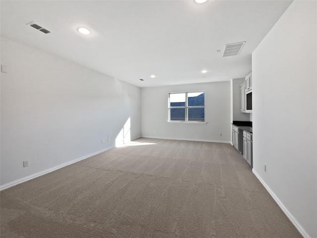 unfurnished living room with carpet floors