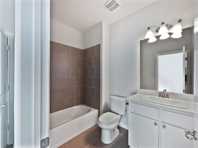 full bathroom featuring vanity, tile patterned floors, toilet, and tiled shower / bath