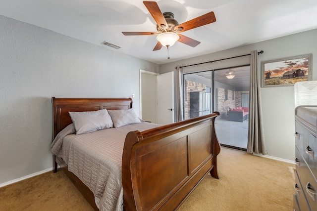 bedroom featuring light colored carpet, access to exterior, and ceiling fan