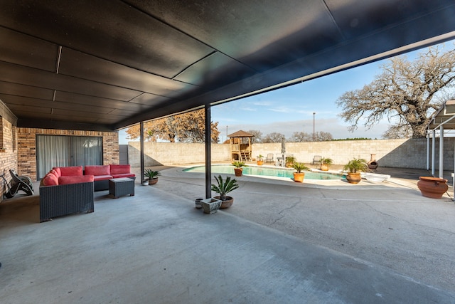 view of patio featuring a fenced in pool and outdoor lounge area