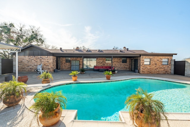 view of swimming pool with a patio area