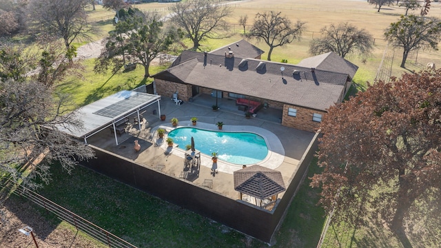 exterior space with a patio and a rural view