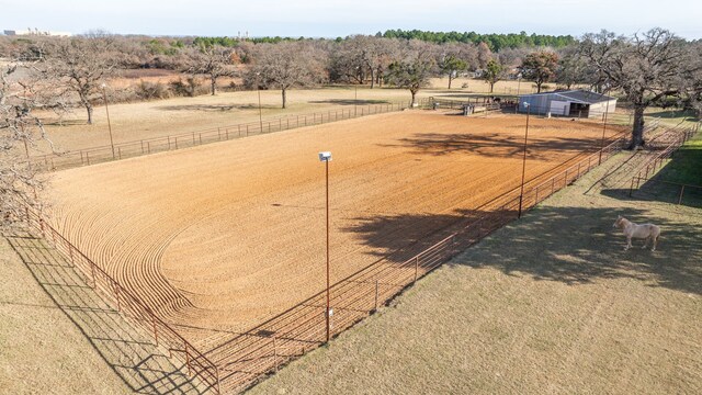 birds eye view of property featuring a rural view