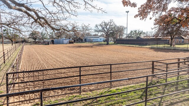 birds eye view of property featuring a rural view