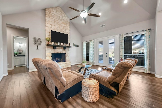 living room with ceiling fan, dark wood-type flooring, a fireplace, and french doors