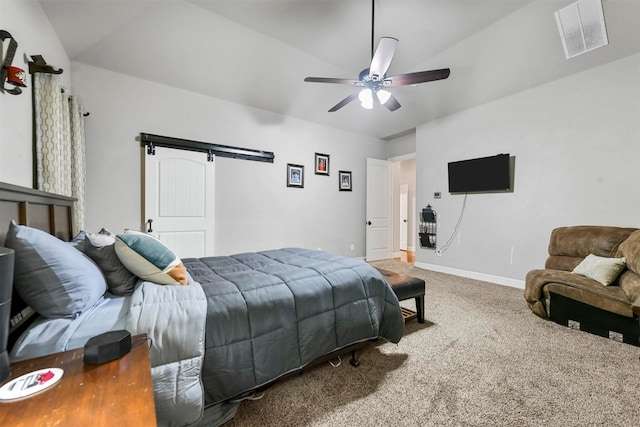 bedroom with carpet flooring, a barn door, ceiling fan, and lofted ceiling