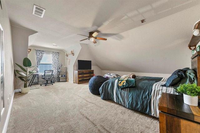 bedroom featuring carpet, vaulted ceiling, and ceiling fan