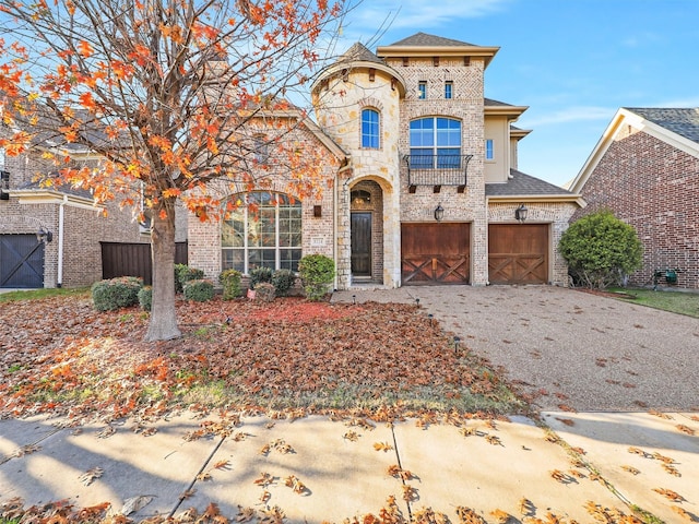 8224 Lindsay Gdns, The Colony, TX 75056 - french country style house featuring an attached garage, asphalt driveway, brick siding, and stone siding