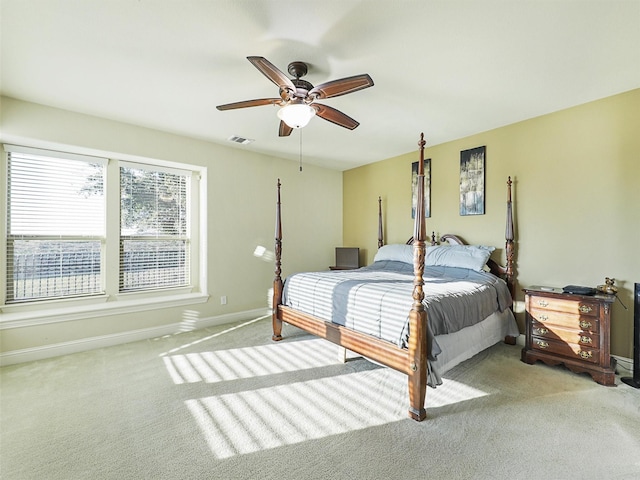 bedroom with light colored carpet and ceiling fan