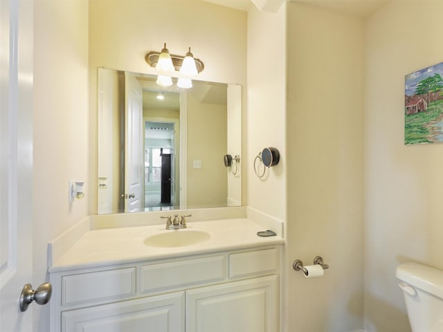 bathroom with toilet and vanity