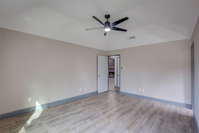 unfurnished room with ceiling fan and light wood-type flooring