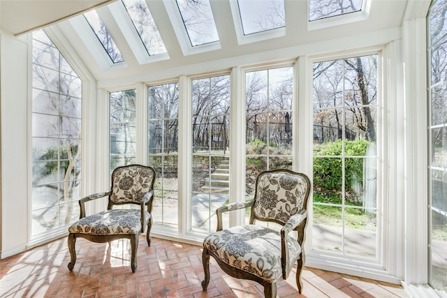 sunroom / solarium featuring vaulted ceiling