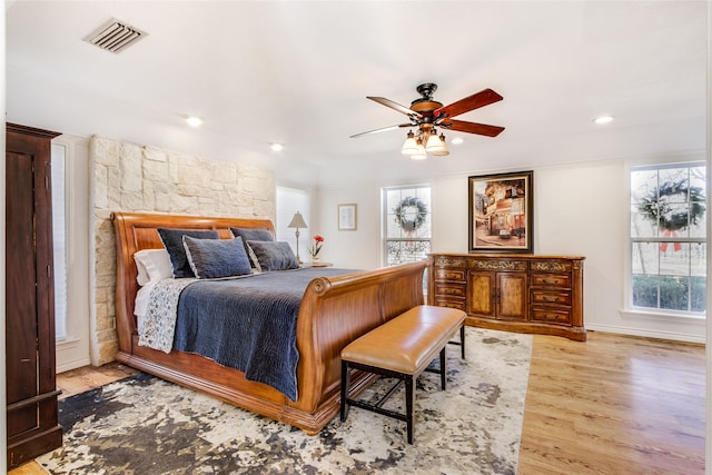 bedroom featuring ceiling fan and light hardwood / wood-style floors