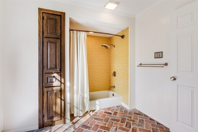 bathroom with shower / bath combination with curtain and ornamental molding