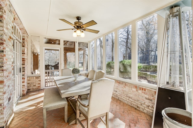 sunroom / solarium with ceiling fan