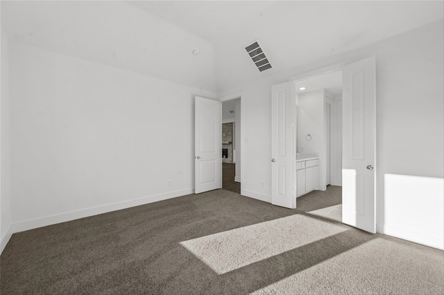 bedroom featuring light carpet and lofted ceiling