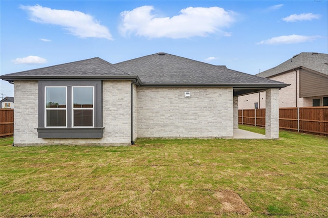 1829 Dolce Ln, Mclendon Chisholm, TX 75032 - back of house featuring a patio area, brick siding, a fenced backyard, a yard, and a shingled roof