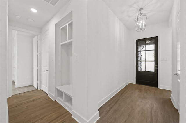 mudroom featuring dark hardwood / wood-style floors and a notable chandelier