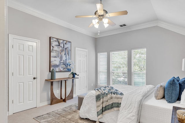 bedroom with ceiling fan, light colored carpet, lofted ceiling, and ornamental molding