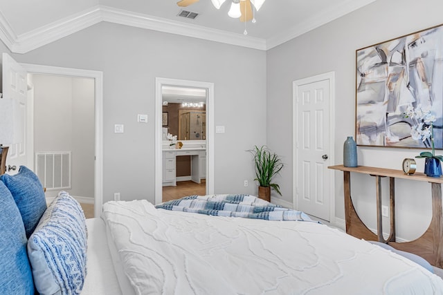 bedroom with connected bathroom, ceiling fan, lofted ceiling, and ornamental molding