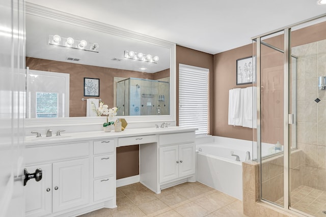 bathroom with tile patterned flooring, vanity, and plus walk in shower