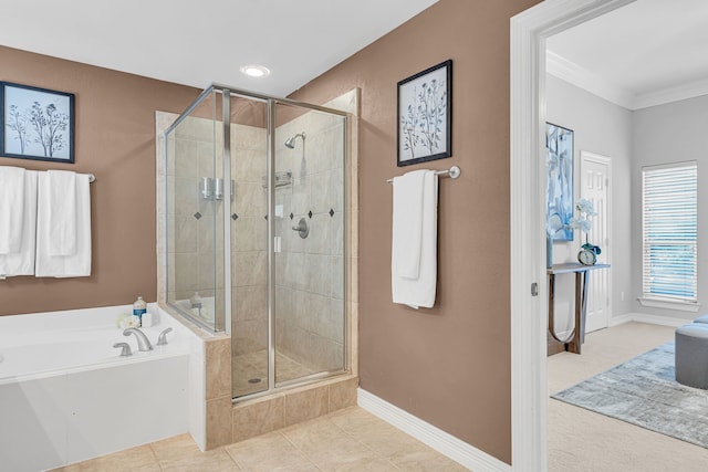 bathroom featuring tile patterned floors, ornamental molding, and independent shower and bath